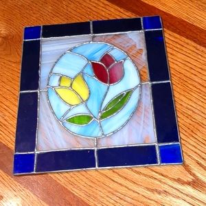 Beautiful piece of stained glass, two tulips in a beautiful blue cobalt frame.